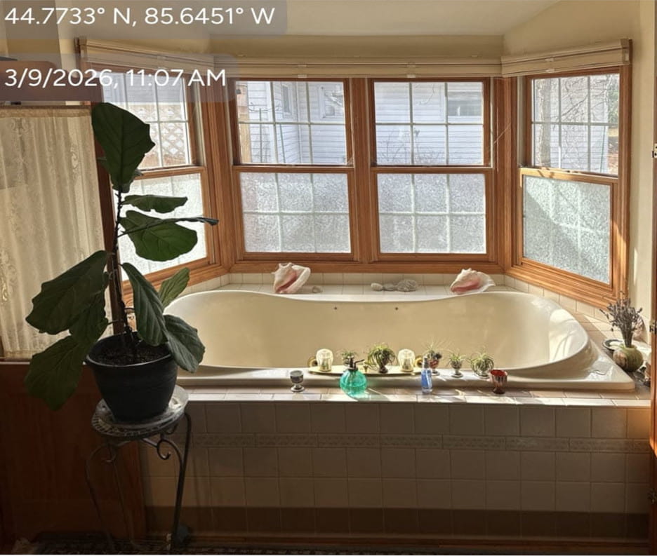 Before photo of an old alcove tub slated for a small bathroom remodel