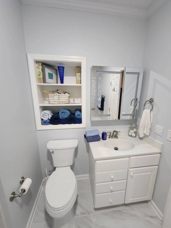 White modern vanity with LED smart mirror and organized storage in Grand Rapids bathroom.