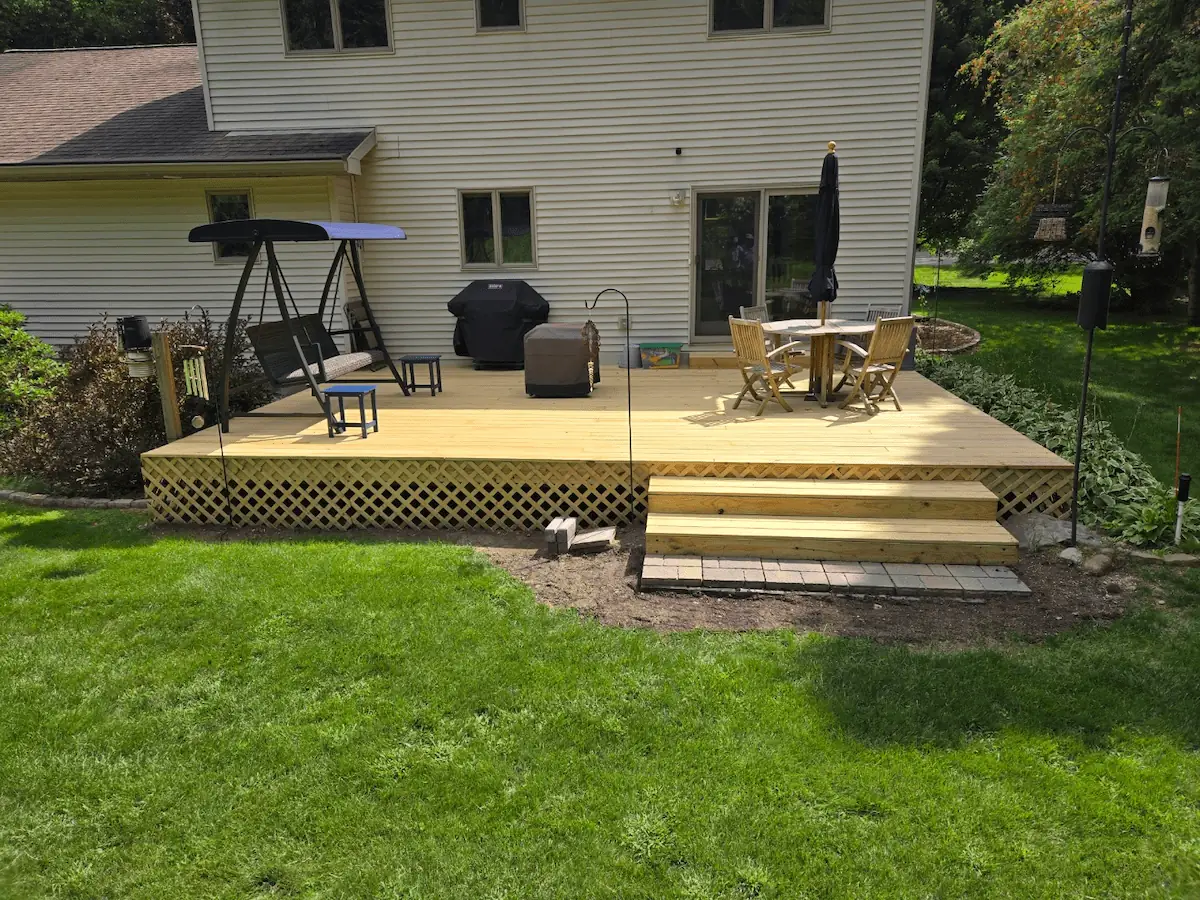 New custom wood deck built by the best deck builders in Michigan for a Traverse City home.