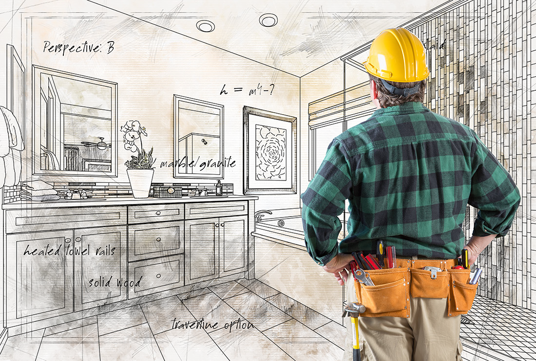 A contractor reviews a hand-drawn kitchen design sketch for a kitchen remodel in Lansing, Michigan, planning for new kitchen cabinets and floor tile.