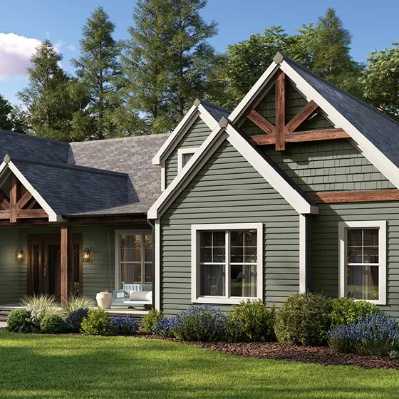 Home exterior featuring Warm Eucalyptus green siding and cedar accents.