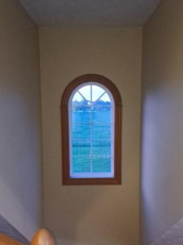 before-arched-staircase-window-replacement-holt-mi.webp