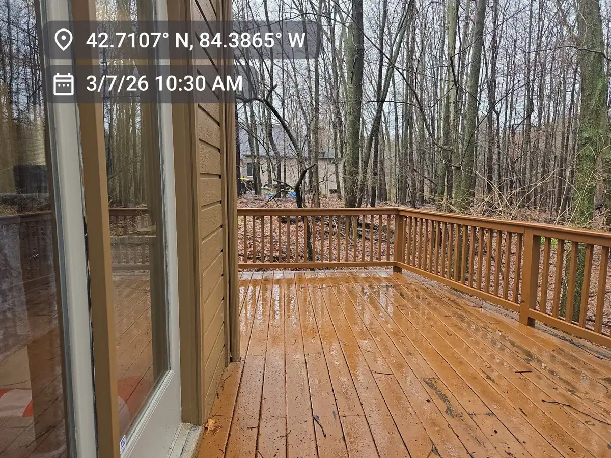 Wet, slippery wood deck surface requiring replacement by expert remodeling contractors.
