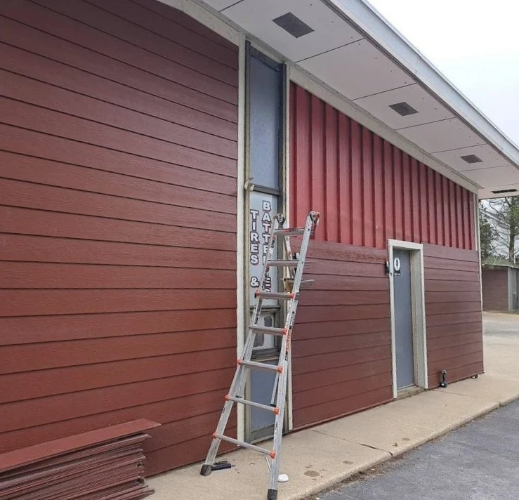 James Hardie fiber cement siding installation replacing old vertical siding in Lansing MI