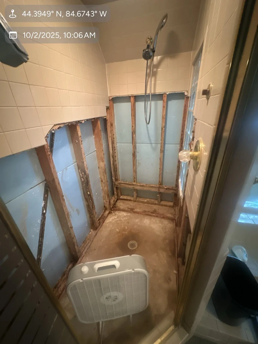 Traverse City shower demo showing water damage repair