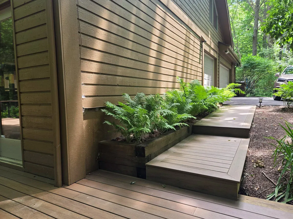 Flawless composite deck stairs built by a top Okemos home improvement contractor.