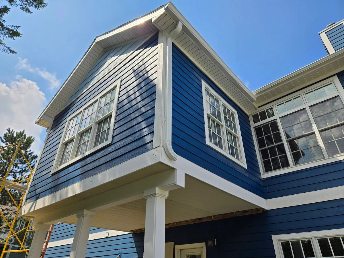 Completed siding and windows for a mother in law suite addition by custom home builders Michigan